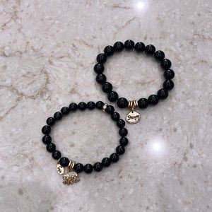 2 black beaded bracelets